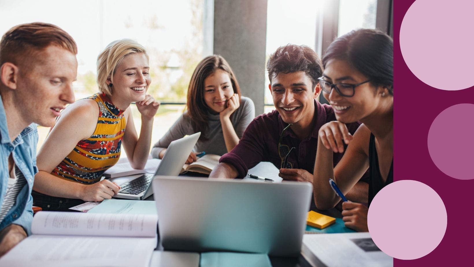 Students learn from each other in front of a computer.