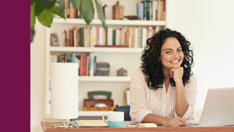 Woman working with computer at her desk.