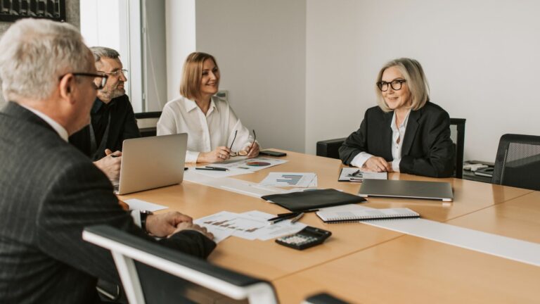 Four people around a table.